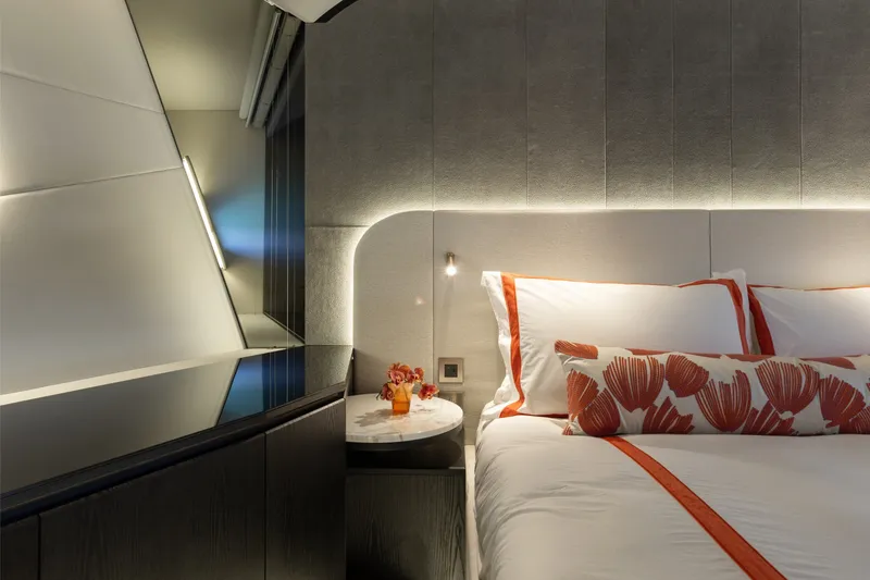 Slide: The Image of Luxurious bedroom interior of 2024 Mangusta 104 REV yacht with modern design and elegant lighting. - 39