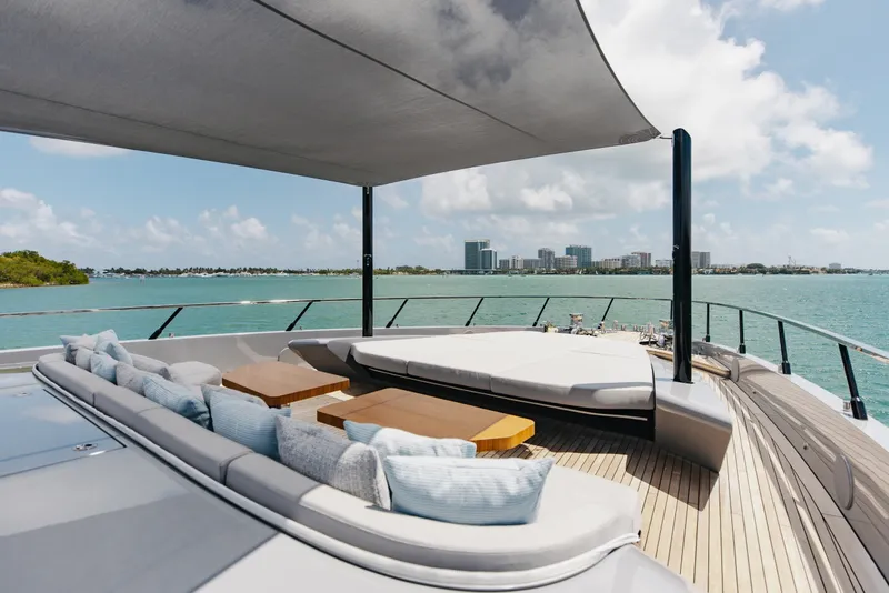 Slide: The Image of Luxurious 2024 Mangusta 104 REV yacht deck with elegant seating and ocean view. - 62