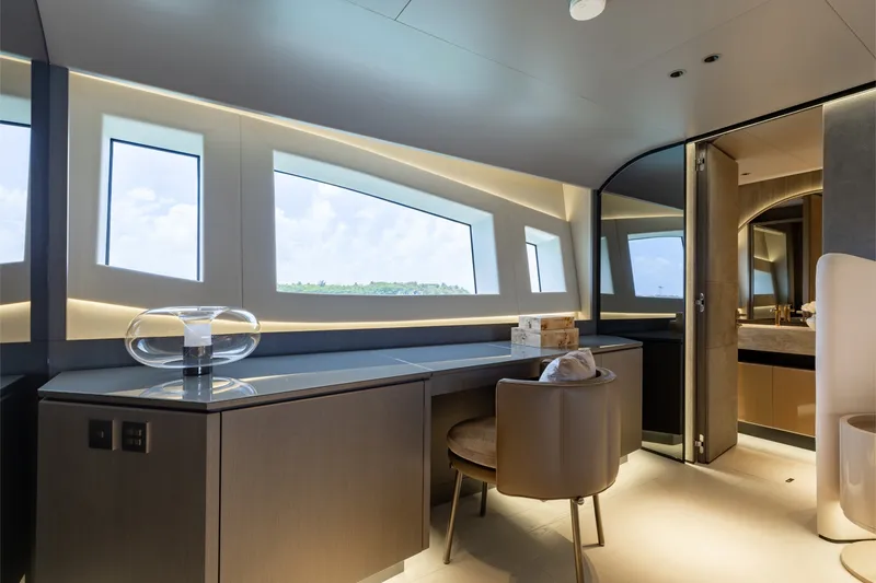 Slide: The Image of Luxurious interior of 2024 Mangusta 104 REV yacht with modern design and panoramic windows. - 29