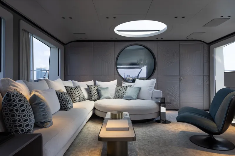 Slide: The Image of Luxurious interior of 2024 Mangusta 104 REV yacht with modern seating and elegant decor. - 21
