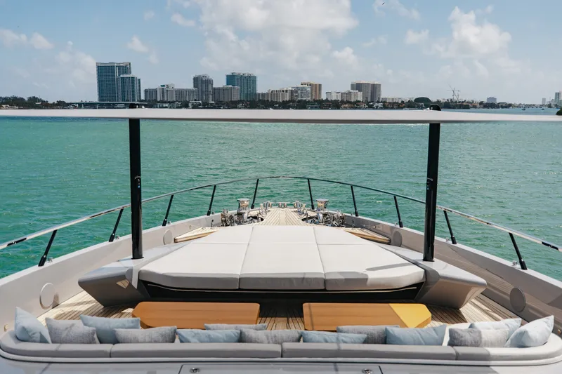Slide: The Image of Luxurious 2024 Mangusta 104 REV yacht deck with city skyline view. - 68