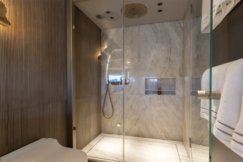 Slide: The Image of Luxurious bathroom in 2024 Mangusta 104 REV yacht, featuring elegant marble shower design. - 36