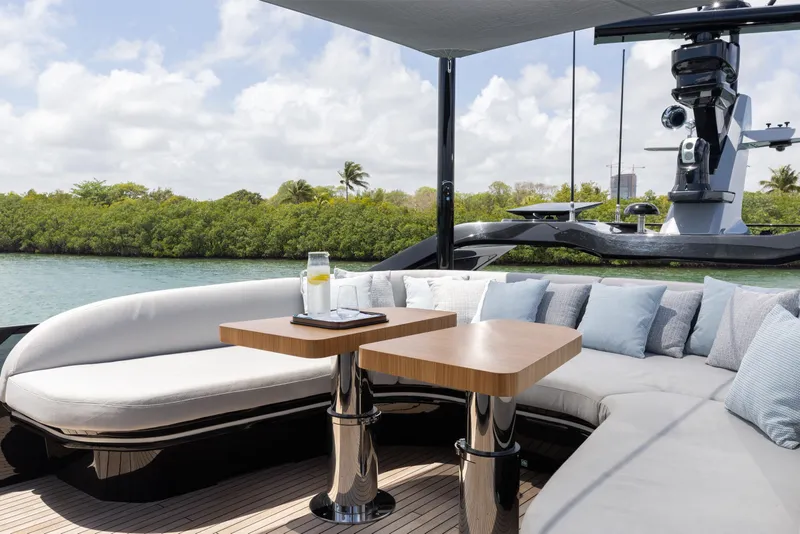 Slide: The Image of Luxurious seating area on 2024 Mangusta 104 REV yacht with scenic water view. - 53