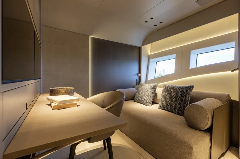 Slide: The Image of Luxurious interior of 2024 Mangusta 104 REV yacht with modern furnishings and ambient lighting. - 47