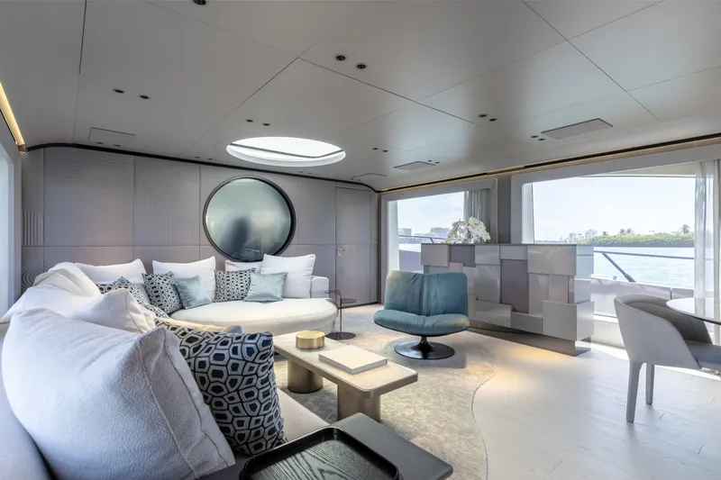 Slide: The Image of Luxurious interior of 2024 Mangusta 104 REV yacht with modern furnishings and large windows. - 22