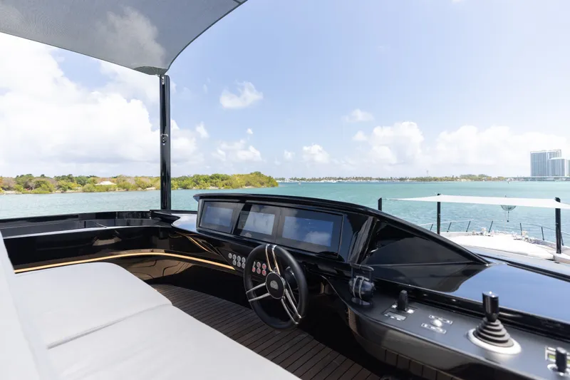 Slide: The Image of Luxurious 2024 Mangusta 104 REV yacht cockpit with sleek design and scenic ocean view. - 61