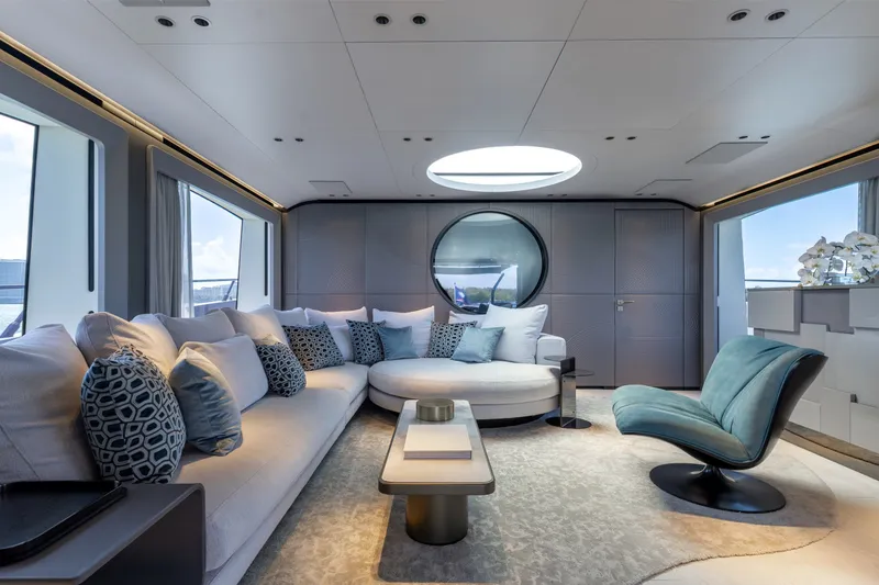 Slide: The Image of Luxurious interior of 2024 Mangusta 104 REV yacht with modern seating and elegant decor. - 20
