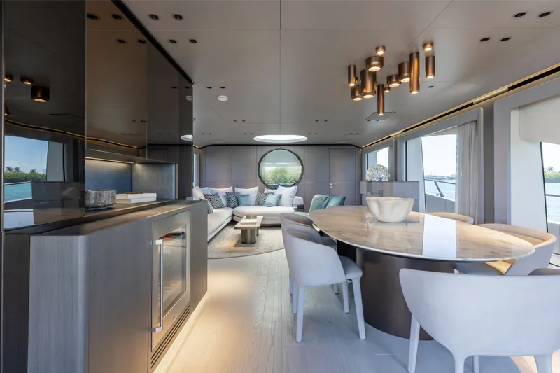 Slide: The Image of Luxurious interior of 2024 Mangusta 104 REV yacht with elegant dining area and modern decor. - 19