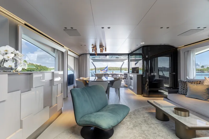 Slide: The Image of Luxurious interior of 2024 Mangusta 104 REV yacht with modern furnishings and scenic views. - 25