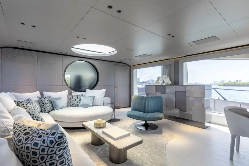 Slide: The Image of Luxurious interior of 2024 Mangusta 104 REV yacht with modern furnishings and large windows. - 23