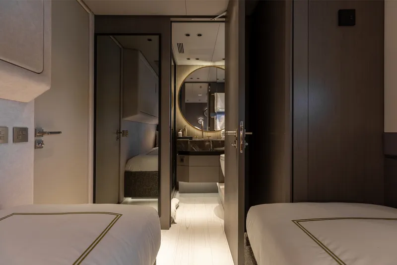 Slide: The Image of Luxurious interior of 2024 Mangusta 104 REV yacht cabin with modern design elements. - 42
