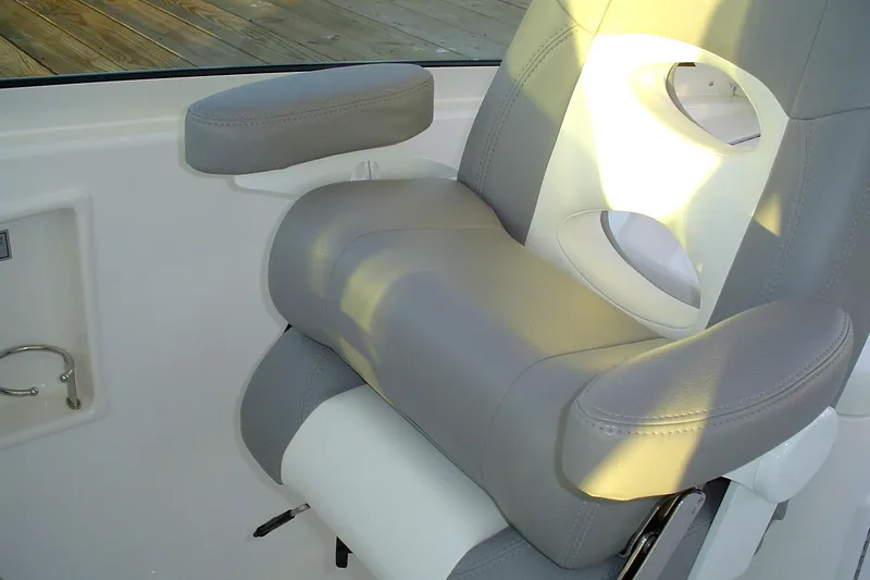 Slide: The Image of 2024 Albemarle 27 Dual Console boat seat with armrests and cup holders. - 14