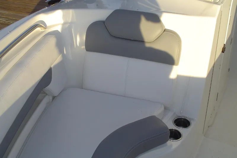 Slide: The Image of 2024 Albemarle 27 Dual Console boat interior with cushioned seating and cup holders. - 28
