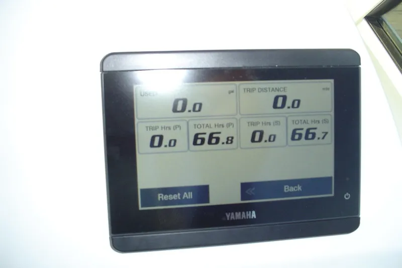 Slide: The Image of Yamaha display on 2024 Albemarle 27 Dual Console showing trip and total hours. - 24