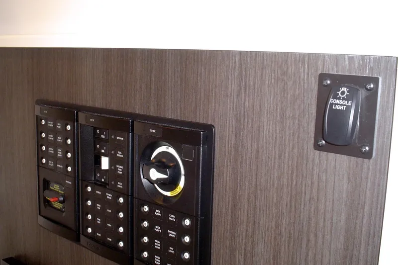 Slide: The Image of Control panel of 2024 Albemarle 27 Dual Console boat with console light switch. - 19