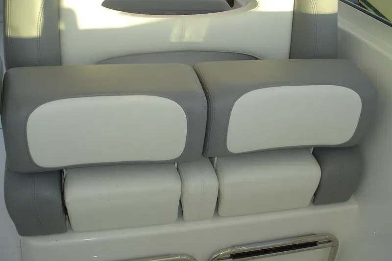 Slide: The Image of 2024 Albemarle 27 Dual Console boat seat with gray and white cushioned design. - 16