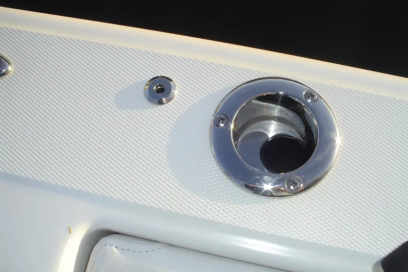 Slide: The Image of 2024 Albemarle 27 Dual Console boat detail with chrome fittings and textured surface. - 18