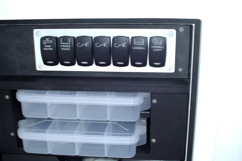 Slide: The Image of Control panel and storage on 2024 Albemarle 27 Dual Console boat. - 21