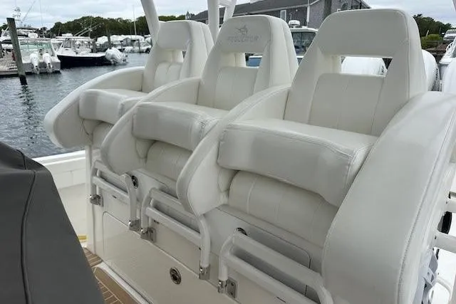 Slide: The Image of Luxury seating on 2022 Regulator 41 boat, docked at marina. - 26