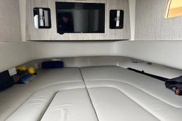 Slide: The Image of 2022 Regulator 41 cabin interior with bed, TV, and storage compartments. - 18