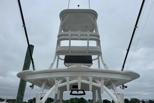 Slide: The Image of 2022 Regulator 41 boat tower against cloudy sky, showcasing sturdy design and structure. - 32