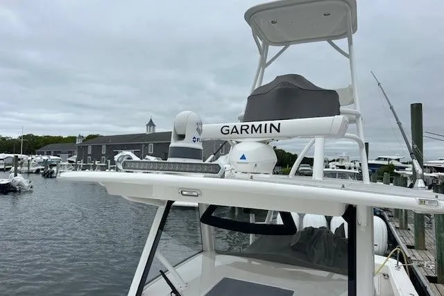 Slide: The Image of 2022 Regulator 41 boat with Garmin equipment docked at a marina. - 34