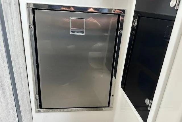 Slide: The Image of Stainless steel refrigerator in 2022 Regulator 41 boat interior. - 21