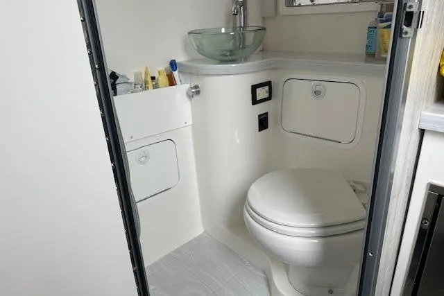 Slide: The Image of 2022 Regulator 41 boat bathroom with modern fixtures and compact design. - 23