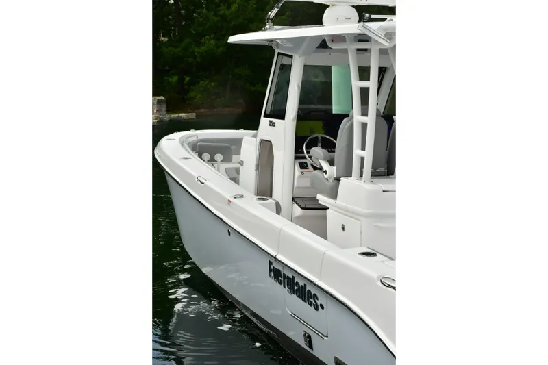 Slide: The Image of 2022 Everglades 335 Center Console boat on water, showcasing sleek design and modern features. - 22