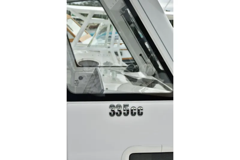Slide: The Image of 2022 Everglades 335 Center Console boat, close-up of model number on side. - 11