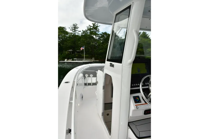 Slide: The Image of 2022 Everglades 335 Center Console boat, featuring sleek design and advanced navigation system. - 26