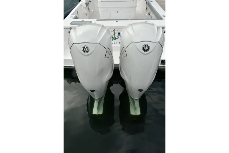 Slide: The Image of Twin outboard engines on a 2022 Everglades 335 Center Console boat. - 18