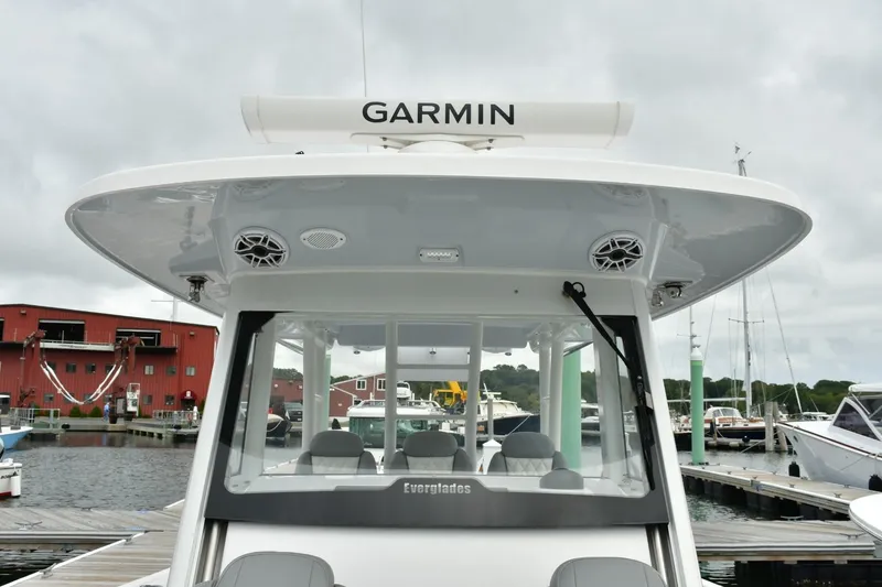 Slide: The Image of 2022 Everglades 335 Center Console boat docked, featuring Garmin equipment. - 33