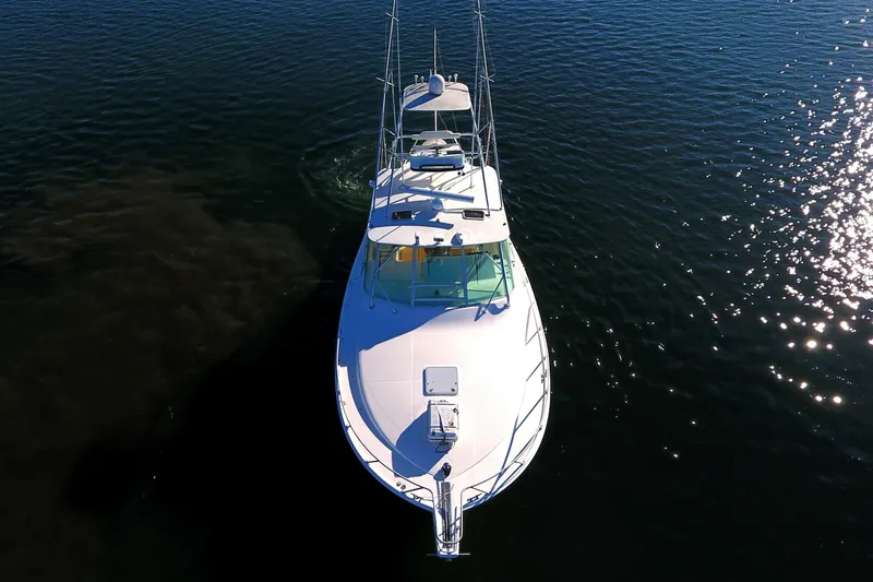 Slide: The Image of Aerial view of 2004 Cabo Express boat on calm water. - 15