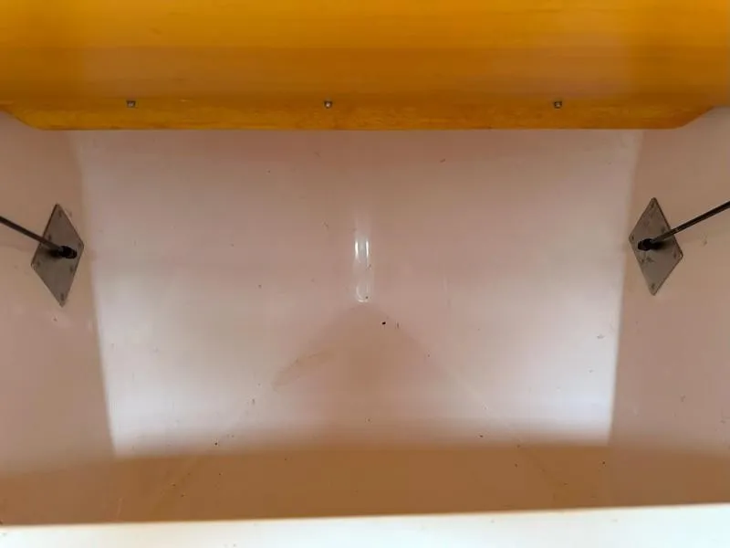 Slide: The Image of Empty storage compartment in a 2004 Cabo Express boat. - 41