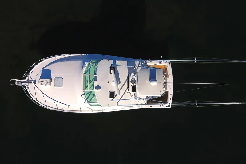 Slide: The Image of Aerial view of 2004 Cabo Express boat on dark water. - 14