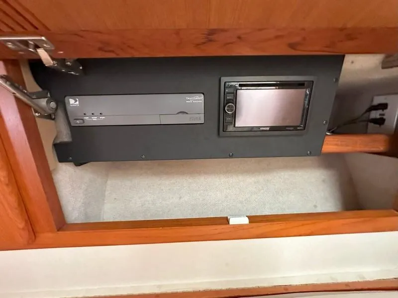 Slide: The Image of 2004 Cabo Express interior electronics panel with TV receiver and control screen. - 38