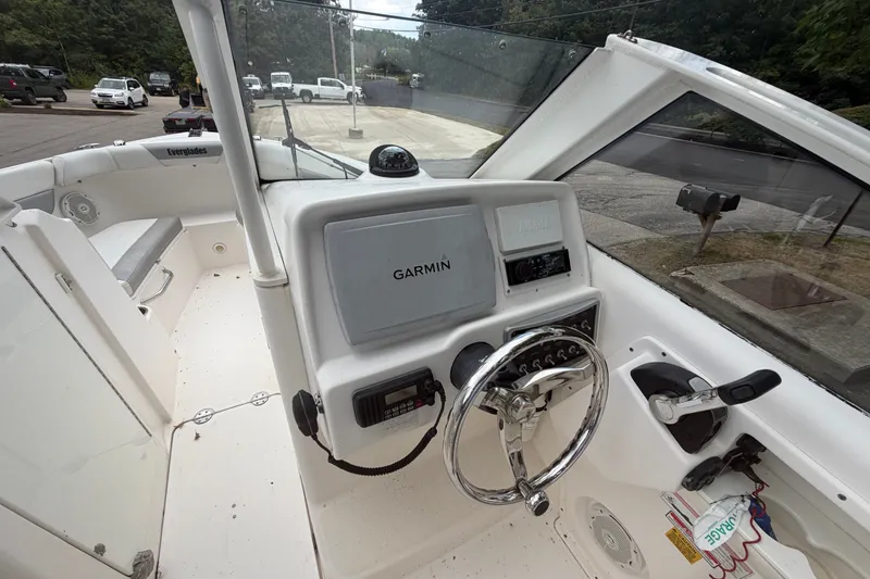 Slide: The Image of Interior view of a 2012 Everglades 230 Dual Console boat with Garmin navigation system. - 10