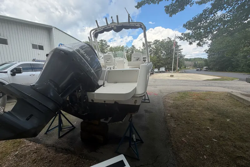 Slide: The Image of 2012 Everglades 230 Dual Console boat with Yamaha outboard motor on stands. - 5