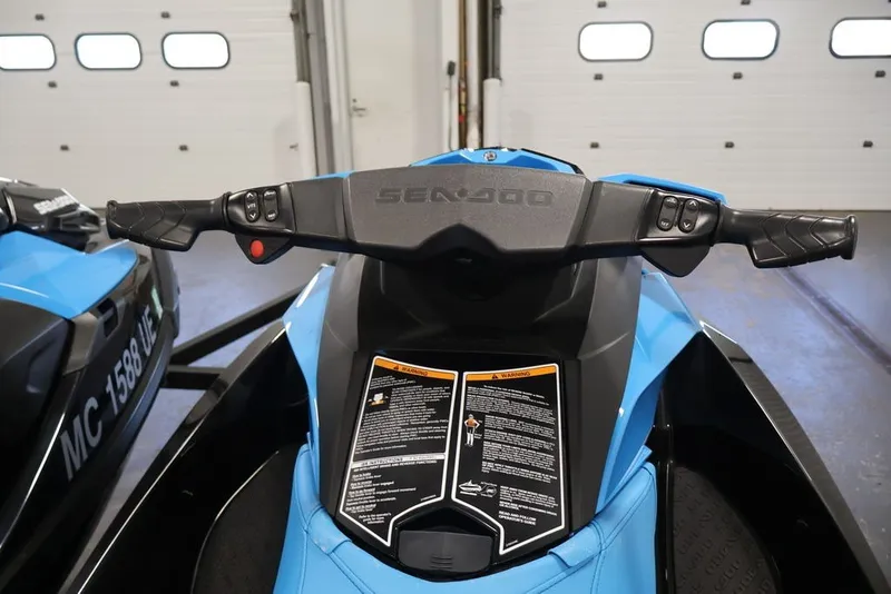 Slide: The Image of 2018 Sea-Doo RXT 230 handlebars and controls in a garage setting. - 20