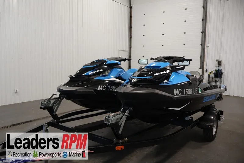 The Image of 2018 Sea-Doo RXT 230 jet skis on trailer in indoor storage facility. - 0