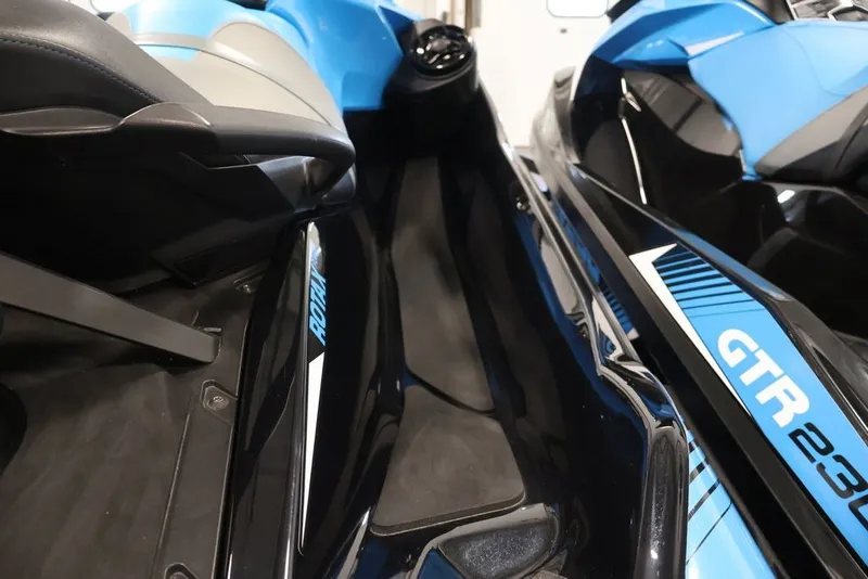 Slide: The Image of 2018 Sea-Doo RXT 230 jet ski, blue and black design, close-up view. - 15
