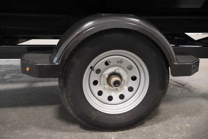 Slide: The Image of Trailer wheel for 2018 Sea-Doo RXT 230, featuring a black fender and silver rim. - 33