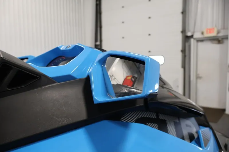 Slide: The Image of 2018 Sea-Doo RXT 230 close-up, featuring blue side mirror and dashboard details. - 16