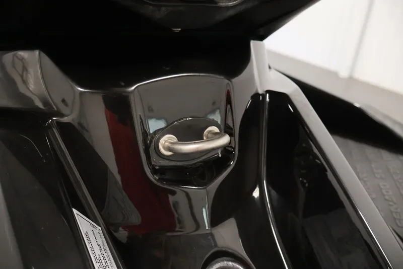 Slide: The Image of Close-up of a 2018 Sea-Doo RXT 230 jet ski's black hull with a metal handle. - 22