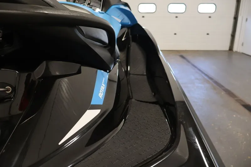 Slide: The Image of 2018 Sea-Doo RXT 230 jet ski, close-up view in a garage setting. - 23