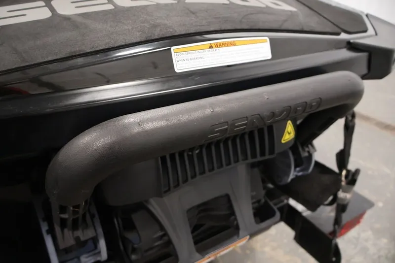 Slide: The Image of Rear view of a 2018 Sea-Doo RXT 230 watercraft, showcasing the handle and warning label. - 18