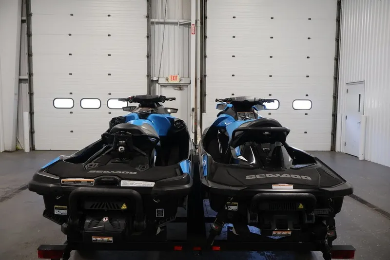 Slide: The Image of Two 2018 Sea-Doo RXT 230 jet skis in a garage setting. - 28
