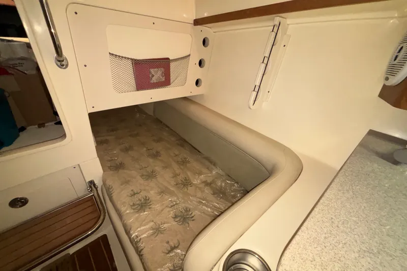 Slide: The Image of Interior cabin of a 2007 Scout 262 Abaco boat with cushioned seating. - 20
