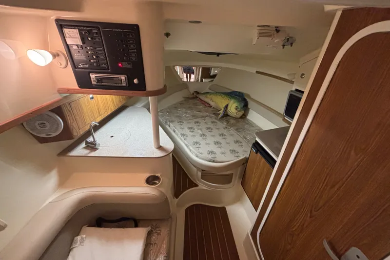 Slide: The Image of Interior of 2007 Scout 262 Abaco boat with cozy cabin and control panel. - 15